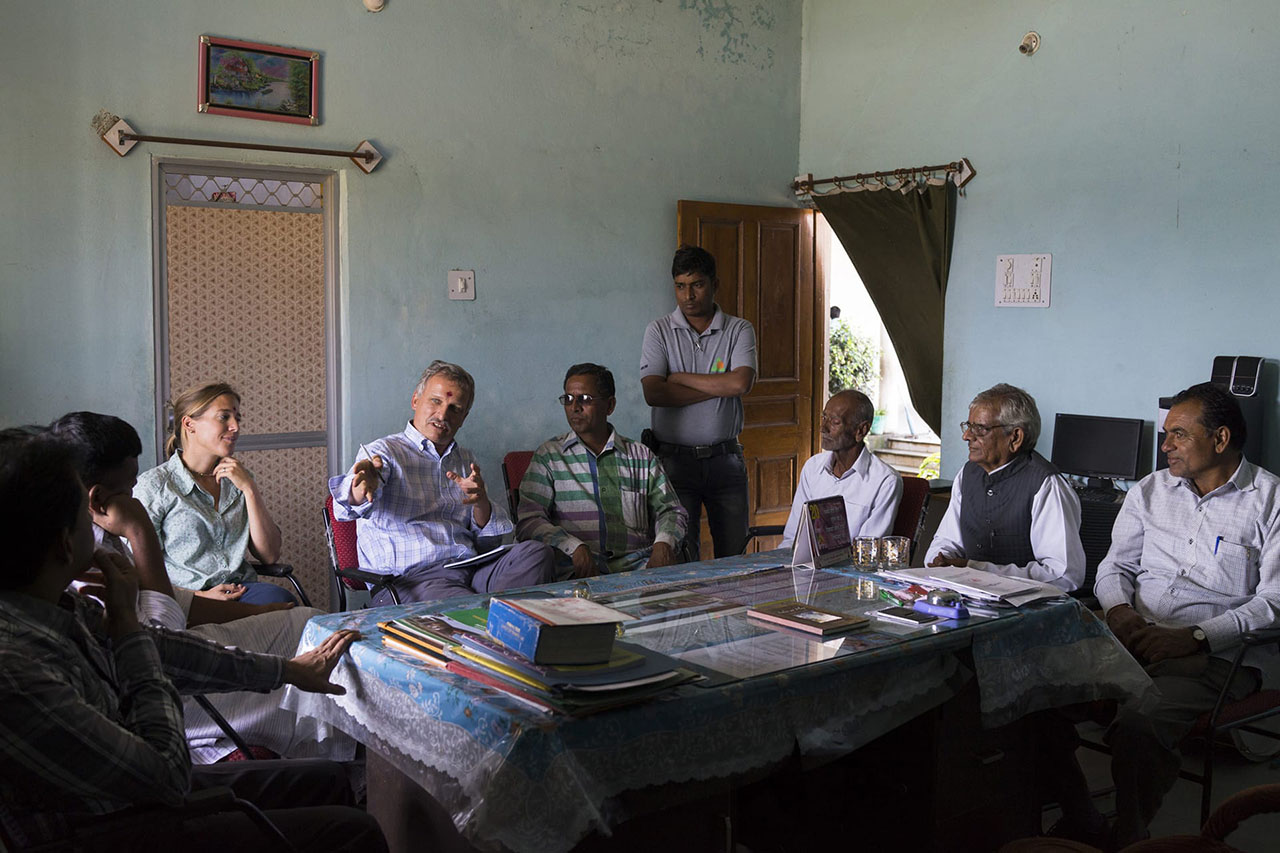 Fairtrade personnel from Switzerland make a presentation to a small group of Fairtrade Cotton Farmer Leaders in Vasudha Vidya Vihar school in Khargone, Madhya Pradesh, India.